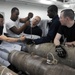 Tightening a tail fin on a GBU-16 laser-guided bomb