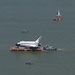 Coast Guard escorts a NASA training shuttle to the Nassau Bay Hilton Hotel dock in League City