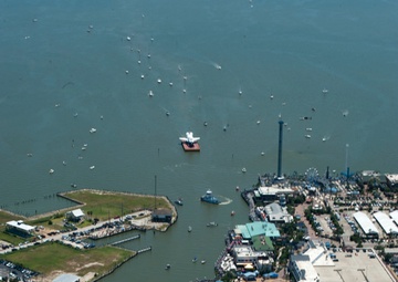 Coast Guard escorts a NASA training shuttle to the Nassau Bay Hilton Hotel dock in League City