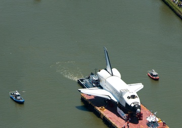 Coast Guard escorts a NASA training shuttle to the Nassau Bay Hilton Hotel dock in League City
