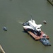 Coast Guard escorts a NASA training shuttle to the Nassau Bay Hilton Hotel dock in League City