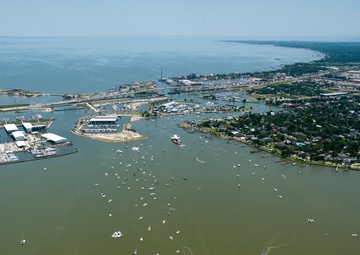 Coast Guard escorts a NASA training shuttle to the Nassau Bay Hilton Hotel dock in League City