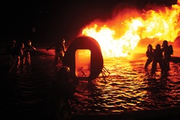 Aircraft rescue, firefighting Marines train through fire, flames