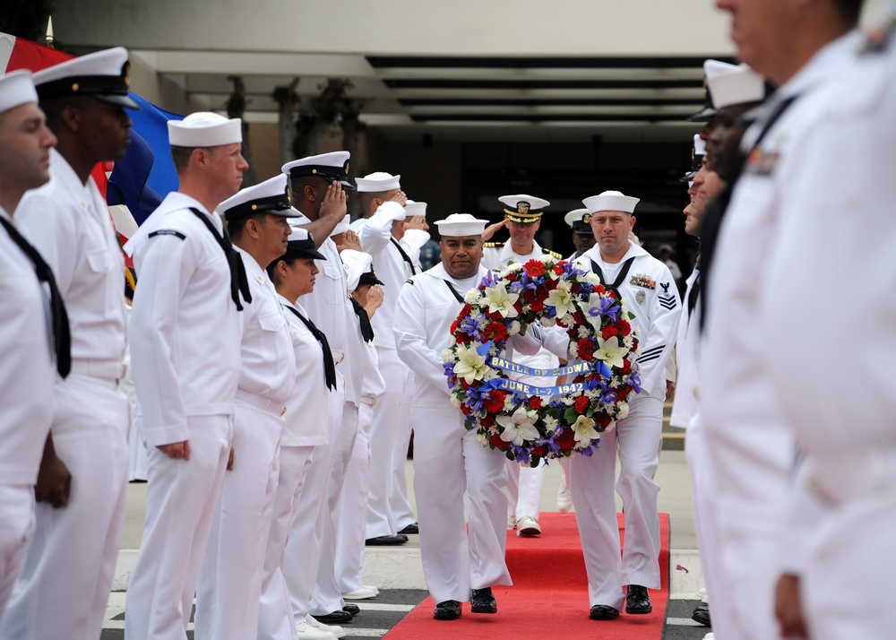 Sailors carry wreath during Battle of Midway ceremony