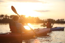 Kayakers take to water in moonlight