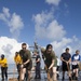 Marines, sailors wash USS Makin Island's flight deck