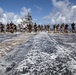 Marines, sailors wash USS Makin Island's flight deck