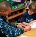 USS John C. Stennis sailors perform community service at school