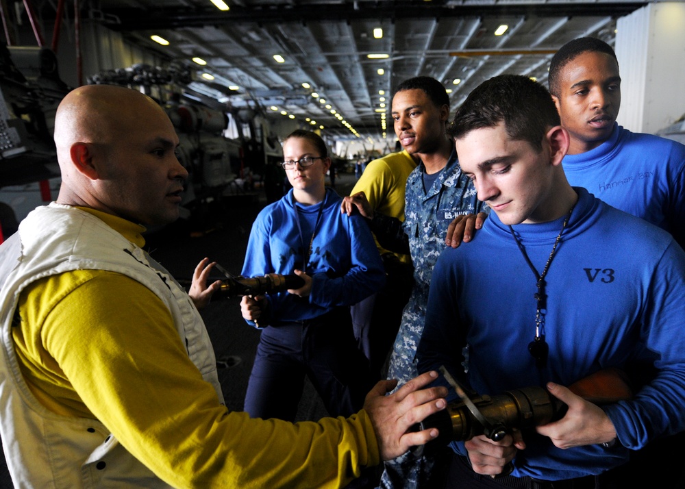 USS Abraham Lincoln sailors prep for firefighting training