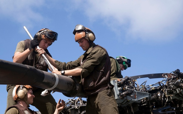 Marines maintain a Super Stallion while deployed