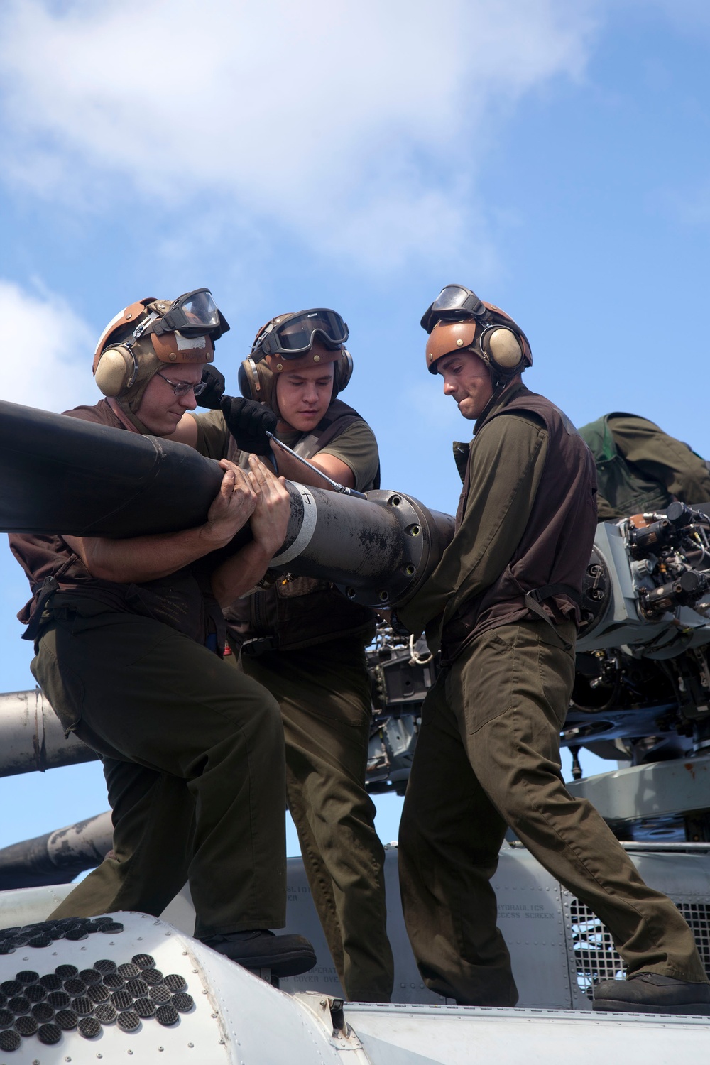 Marines maintain a Super Stallion while deployed