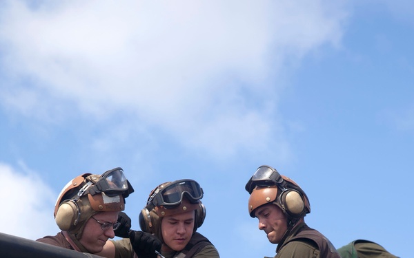 Marines maintain a Super Stallion while deployed