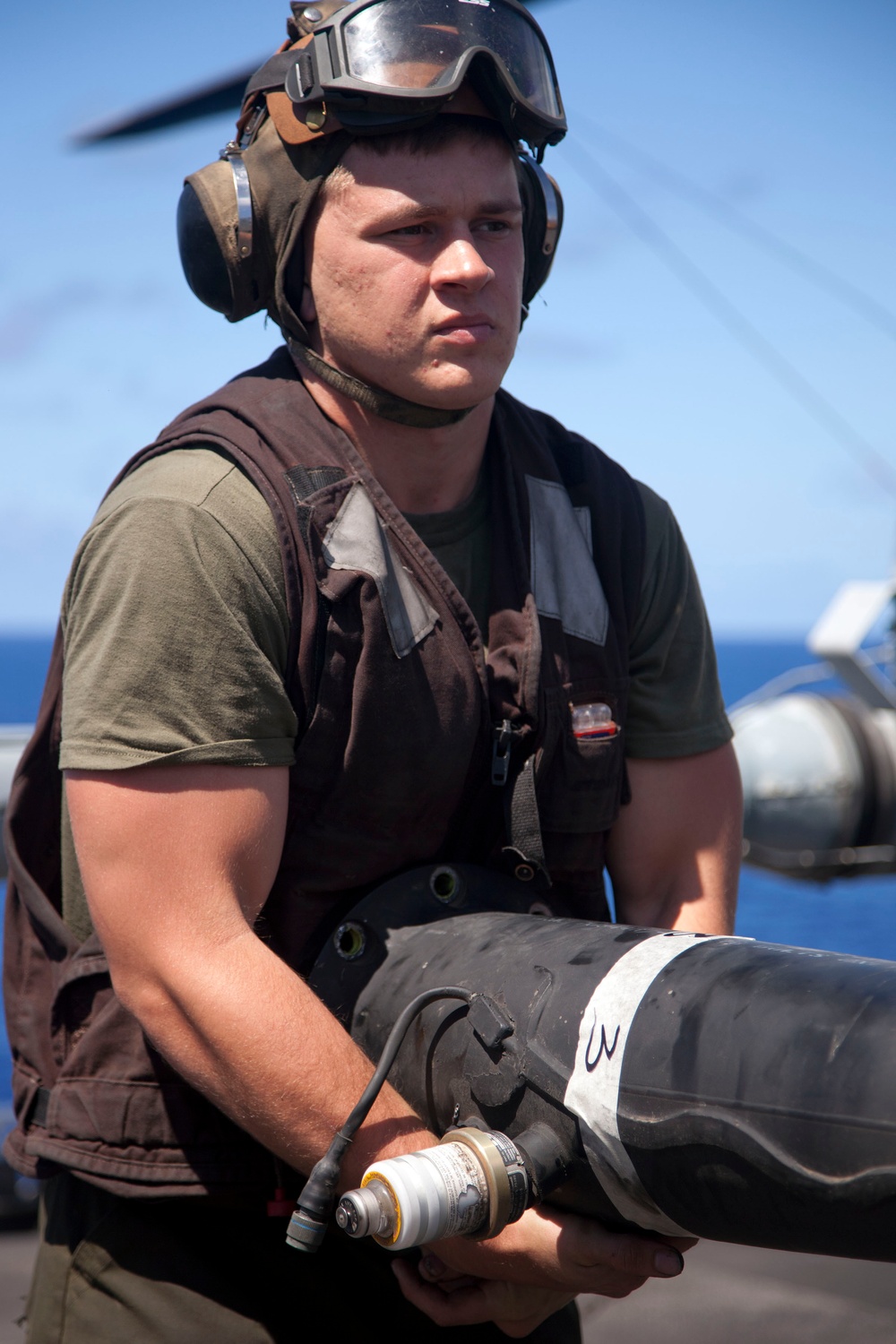 Marines maintain a Super Stallion while deployed