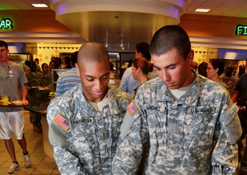 Soldiers celebrate Army birthday with food, cake, sabers