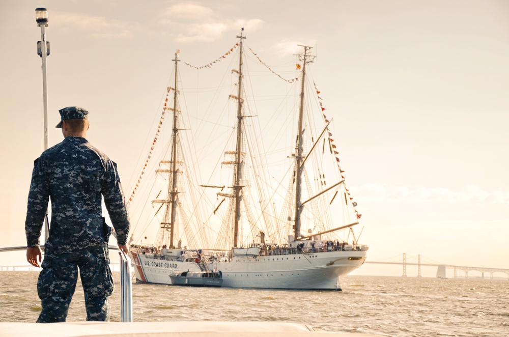 Naval Academy launch lies alongside Coast Guard Barque Eagle