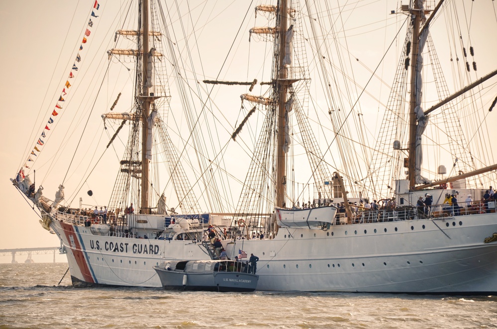 US Naval Academy launch lies alongside US Coast Guard Barque Eagle