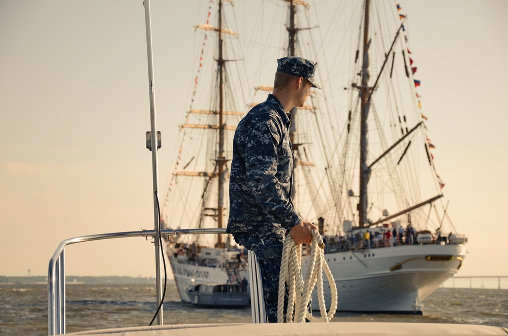 Navy Engineman 1st Class Sewel Baskett stands ready on the bow of a U.S. Naval Academy launch