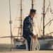 Navy Engineman 1st Class Sewel Baskett stands ready on the bow of a U.S. Naval Academy launch