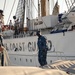 US Naval Academy launch comes alongside Coast Guard Cutter