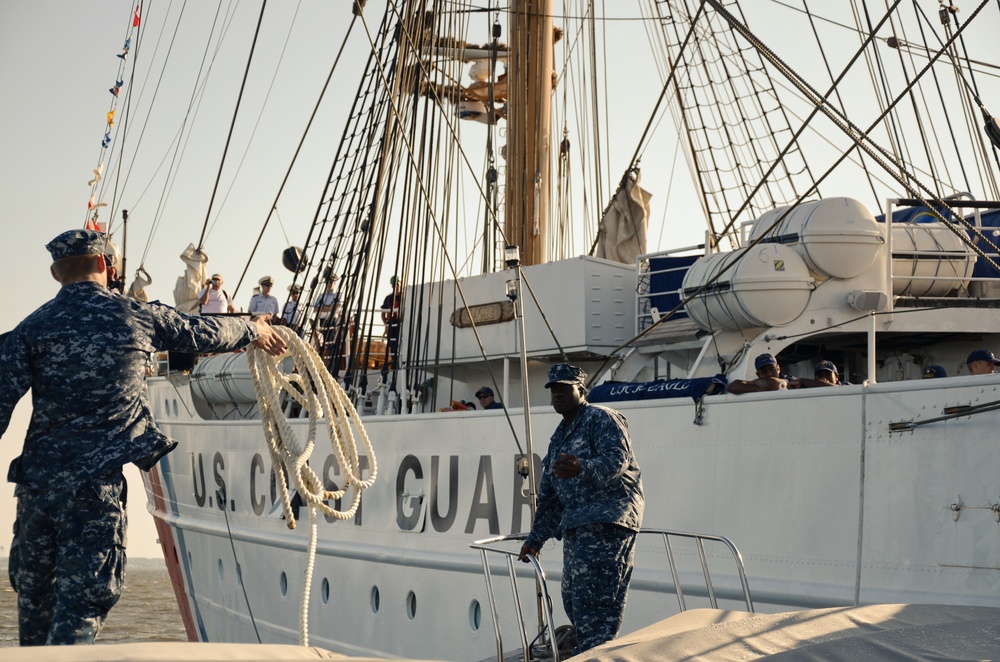 Navy boat crewmember passes a line