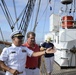 Navy Cmdr. Victor A. Barrios explains operations performed at the helm by Coast Guard Academy cadets