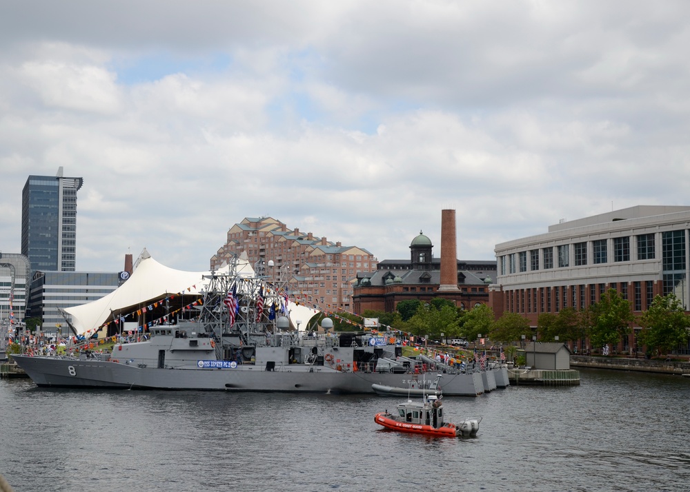 Coast Guard Vessel 25667 patrols near the USS Zephyr (PC 8) in the Port of Baltimore