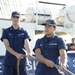 Two Coast Guard Academy cadets aboard US Coast Guard Barque Eagle (WIX 327) take tension on a mooring line