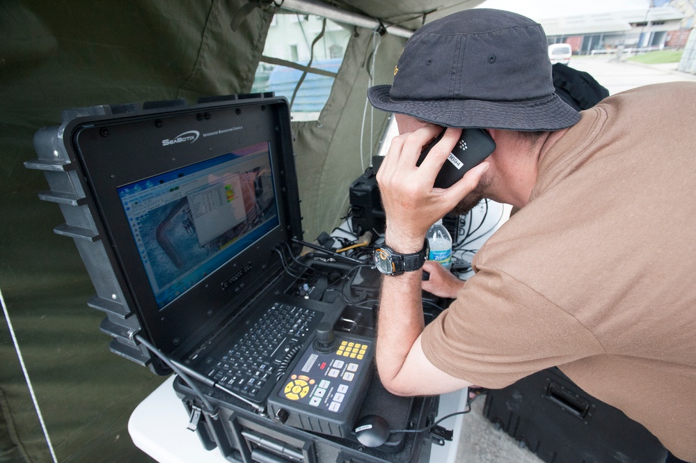 A Canadian sailor trouble shoots his remotely operated vehicle control console at Exercise Tradewinds 2012