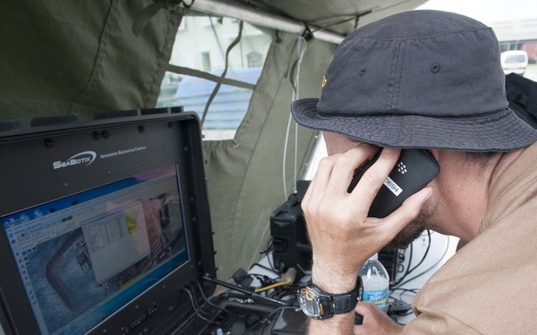 A Canadian sailor trouble shoots his remotely operated vehicle control console at Exercise Tradewinds 2012