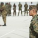 Marine Corps Cpl. Johnny Tau stands at attention as he awaits the command to unfurl the American flag during the opening ceremony for Exercise Tradewinds 2012