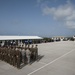 Service members from multiple nations bow their heads during the opening invocation at Exercise Tradewinds 2012