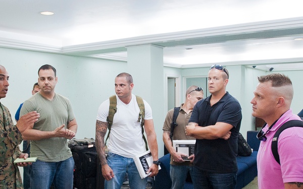 Marine Corps Gunnery Sgt. Jose Marquez briefs a group of newly arrived Coast Guardsmen about the barracks rules and regulations during Exercise Tradewinds 2012