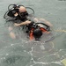 Canadian Navy Leading Seaman Dave Cheeseman performs a leak check on Canadian Navy Chief Petty Officer 2nd Class Andy Tiffin before performing a diving exercise during Exercise Tradewinds 2012