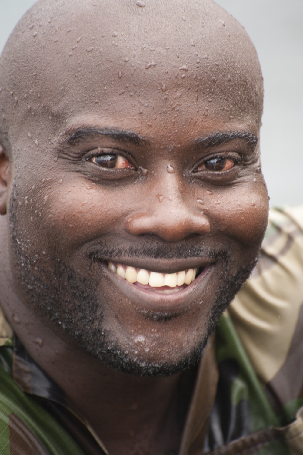 A member of the Barbados Defence Force takes a break after perform vessel debarkation drills during Exercise Tradewinds 2012