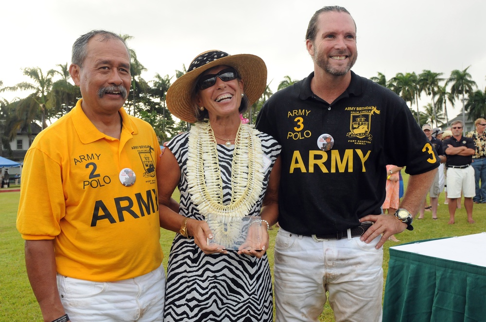 Jeannine Wiercinski receives trophy from Army polo players