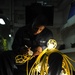USS Nimitz sailor at work in lighting shop