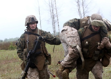 3/25 Marines carry fellow comrade