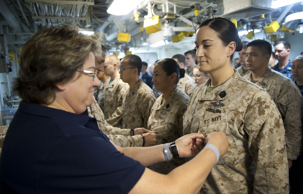 Mother pins daughter aboard USS Makin Island