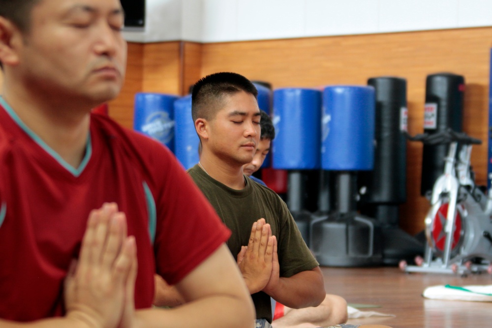 MCAS Iwakuni men practice yoga for Father's Day