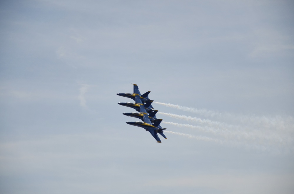 Blue Angels 1, 2, 3 and 4 are lined up wing to wing over Baltimore Harbor