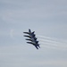 Blue Angels 1, 2, 3 and 4 are lined up wing to wing over Baltimore Harbor