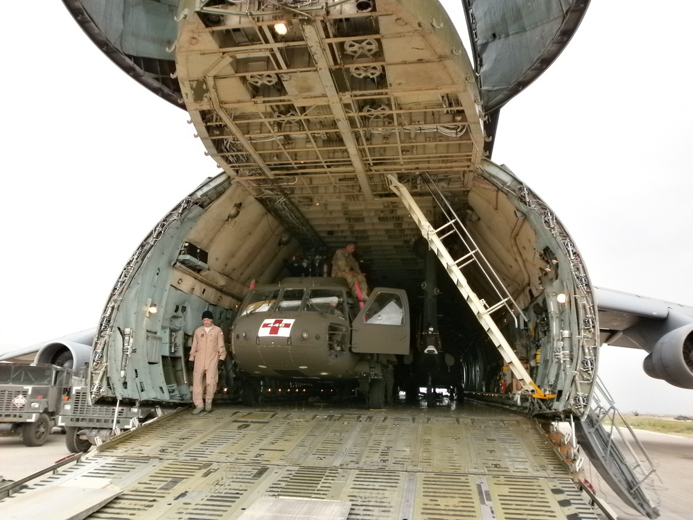 Soldiers offload helicopter in Afghanistan