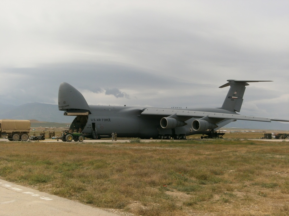 Soldiers offload helicopter in Afghanistan