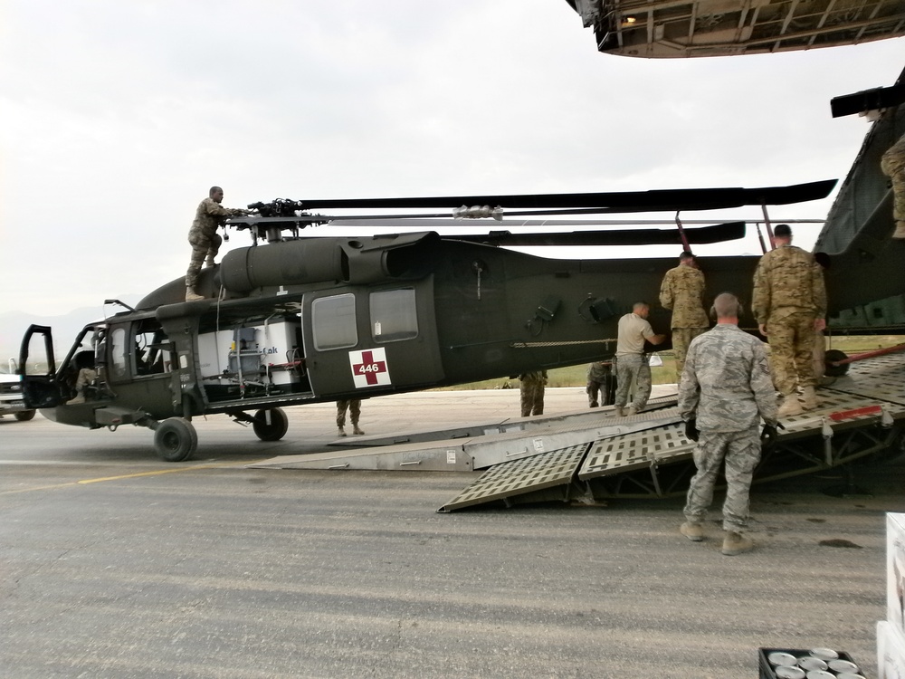 Soldiers offload helicopter in Afghanistan