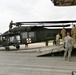 Soldiers offload helicopter in Afghanistan