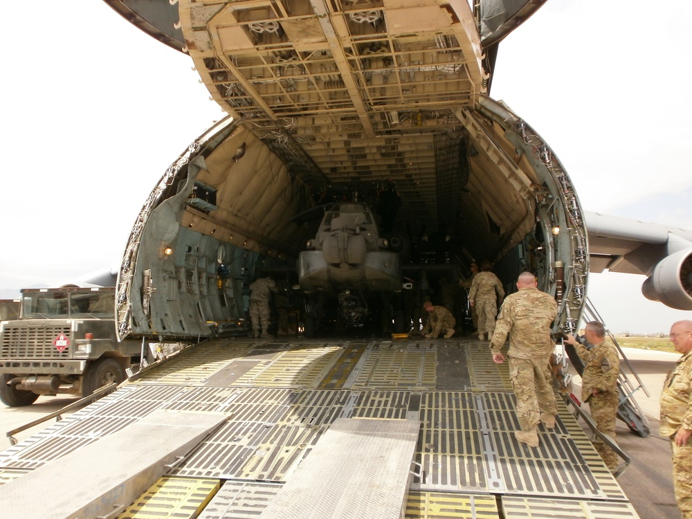 Soldiers offload helicopter in Afghanistan