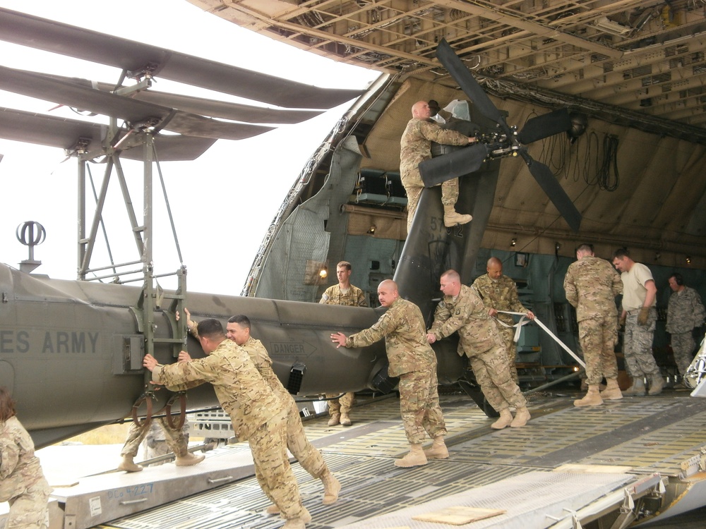 Soldiers offload helicopter in Afghanistan