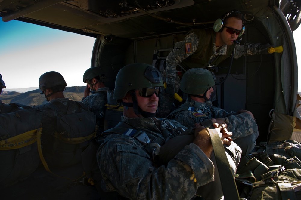 Utah Army National Guard performing static line jumps from Black Hawks