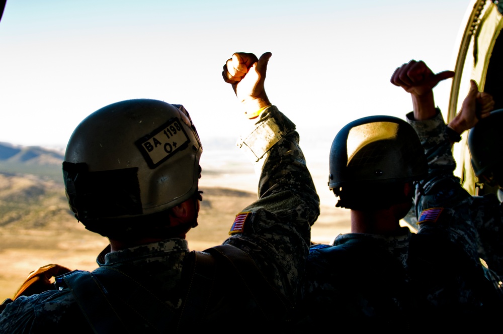 Utah Army National Guard performing static line jumps from Black Hawks