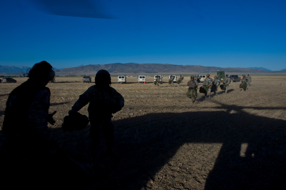 Utah Army National Guard performing static line jumps from Black Hawks